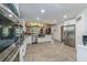 Open concept kitchen boasting stainless steel appliances and a herringbone tile floor at 3355 Scarlet Dr, Sanford, FL 32773