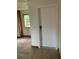 Simple hallway with tile floors and a door at 3355 Scarlet Dr, Sanford, FL 32773