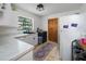 Bright laundry room with washer, dryer, and ample counter space at 3355 Scarlet Dr, Sanford, FL 32773