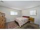 Cozy bedroom with wood dresser and patterned bedding at 3355 Scarlet Dr, Sanford, FL 32773