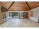 Spacious living room with a stone fireplace and access to the deck at 3355 Scarlet Dr, Sanford, FL 32773