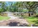Stone house with a two car garage at 3355 Scarlet Dr, Sanford, FL 32773