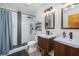 Bathroom with double vanity and a grey and white shower at 3355 Scarlet Dr, Sanford, FL 32773