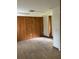 Spacious office with wood paneled walls and tile floors at 3355 Scarlet Dr, Sanford, FL 32773