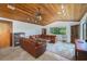 Relaxing living room with leather sofas and wood-paneled ceiling at 3355 Scarlet Dr, Sanford, FL 32773