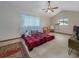 Upstairs bedroom with a red and black plaid comforter at 3355 Scarlet Dr, Sanford, FL 32773