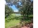 Deck overlooking a tranquil lake with lush greenery at 3355 Scarlet Dr, Sanford, FL 32773