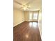 Bright bedroom with ceiling fan and wood-look flooring at 1059 S Hiawassee Rd # 1824, Orlando, FL 32835