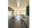 Kitchen with stainless steel appliances and view into living room at 1059 S Hiawassee Rd # 1824, Orlando, FL 32835