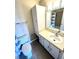Bathroom with single sink vanity, linen cabinet, and shower/tub at 1059 S Hiawassee Rd # 1824, Orlando, FL 32835