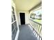 Private balcony with view of trees and neighboring buildings at 1059 S Hiawassee Rd # 1824, Orlando, FL 32835