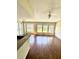 Living room with wood floors and large windows at 1059 S Hiawassee Rd # 1824, Orlando, FL 32835