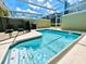 Private screened-in pool with patio furniture at 962 Splash Shot Pl, Davenport, FL 33896