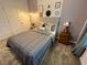 Cozy bedroom with a comfortable bed, travel themed decor, and plenty of natural light at 962 Splash Shot Pl, Davenport, FL 33896