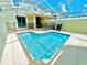 Private screened-in pool with patio furniture at 962 Splash Shot Pl, Davenport, FL 33896