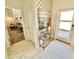 Light and airy entryway with marble flooring and stylish decor at 962 Splash Shot Pl, Davenport, FL 33896