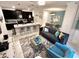 Open concept living space with kitchen, dining, and sitting areas at 962 Splash Shot Pl, Davenport, FL 33896