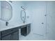 Modern bathroom with double vanity, marble tile, and an updated shower at 1146 Atlantic Ave, Fruitland Park, FL 34731