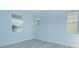 Bright bedroom with light walls and wood-look flooring at 1146 Atlantic Ave, Fruitland Park, FL 34731