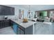 Open concept kitchen and living area with modern finishes at 1146 Atlantic Ave, Fruitland Park, FL 34731