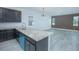 Modern kitchen with island and breakfast bar at 1146 Atlantic Ave, Fruitland Park, FL 34731
