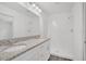 Bathroom with double vanity, granite countertop, and shower at 297 Malauka Run, Ocklawaha, FL 32179
