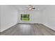 Spacious living area with vinyl flooring and natural light at 297 Malauka Run, Ocklawaha, FL 32179
