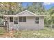 Front view of a renovated gray house with fenced yard at 448 Nw 18Th Ave, Ocala, FL 34475