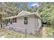 Side view of a renovated gray house with fenced yard at 448 Nw 18Th Ave, Ocala, FL 34475