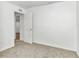 Simple bedroom with neutral carpeting and an open door at 448 Nw 18Th Ave, Ocala, FL 34475