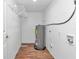 Laundry room with shelving and a water heater at 448 Nw 18Th Ave, Ocala, FL 34475