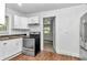 Modern kitchen featuring white cabinets and a stove at 448 Nw 18Th Ave, Ocala, FL 34475