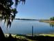 Scenic lakefront property with tranquil water views and lush vegetation at 4146 Versailles Dr # 4146D, Orlando, FL 32808
