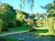 Brick path winds through lush landscaping at 4146 Versailles Dr # 4146D, Orlando, FL 32808