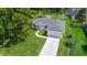 New construction home with a large yard and driveway at 370 Routh Ave, New Smyrna Beach, FL 32168