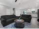 Spacious living room with open floor plan to kitchen area at 370 Routh Ave, New Smyrna Beach, FL 32168