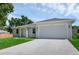 Newly built home with light gray exterior and two-car garage at 370 Routh Ave, New Smyrna Beach, FL 32168