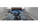 Bedroom with Black Panther bedding and nightstands at 370 Routh Ave, New Smyrna Beach, FL 32168