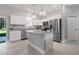 Modern kitchen with stainless steel appliances and island at 370 Routh Ave, New Smyrna Beach, FL 32168