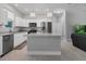 Open concept kitchen island with granite countertops and stainless steel appliances at 370 Routh Ave, New Smyrna Beach, FL 32168