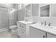 Double vanity bathroom with a large walk in shower at 370 Routh Ave, New Smyrna Beach, FL 32168