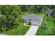 New construction home with a large yard and driveway at 370 Routh Ave, New Smyrna Beach, FL 32168
