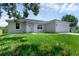 Newly built home with light gray exterior and two-car garage at 370 Routh Ave, New Smyrna Beach, FL 32168