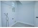 Laundry room with washer and dryer hookups and shelving at 1146 Atlantic Ave, Fruitland Park, FL 34731