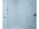 Large shower with marble-look tile and a rain shower head at 1146 Atlantic Ave, Fruitland Park, FL 34731