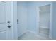 Clean entryway with white door and gray floor tile at 1146 Atlantic Ave, Fruitland Park, FL 34731