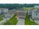 Aerial view of two-story house and neighborhood at 1146 Atlantic Ave, Fruitland Park, FL 34731