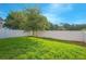 Private backyard with fenced yard and lush grass at 1146 Atlantic Ave, Fruitland Park, FL 34731