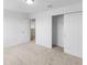 Bright bedroom with carpet, neutral walls, and double door closet at 3198 Viceroy Ct, Poinciana, FL 34759