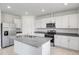 Modern kitchen with island and stainless steel appliances at 3198 Viceroy Ct, Poinciana, FL 34759